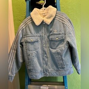 Women’s Adidas clear blue jean jacket with white stripes. Size small never worn.